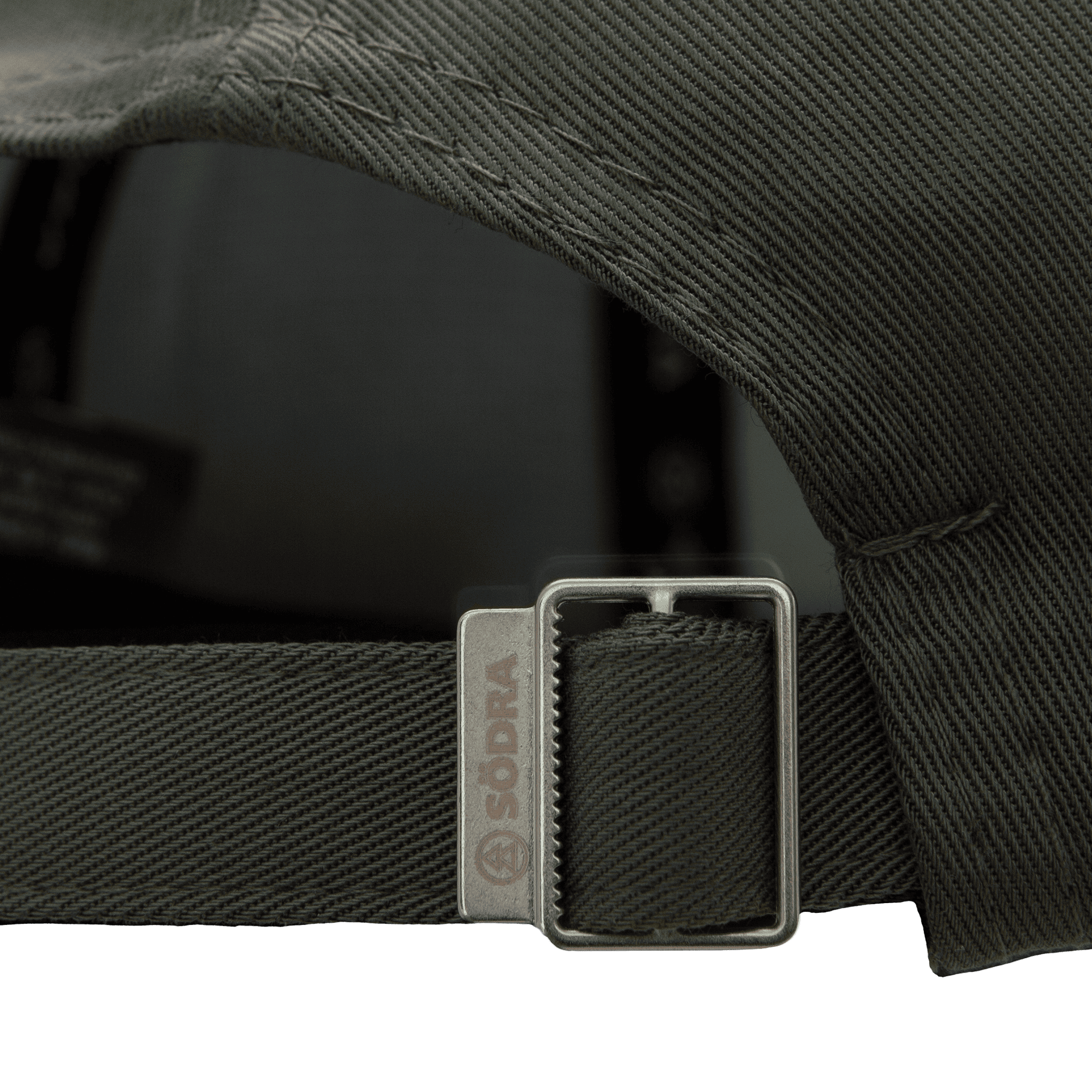 spänne med graverad södralogga